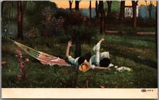c1910s Romance Comic Greetings Postcard Boy & Girl Kissing / Upset Hammock picture
