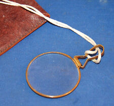 A large 19th century loupe magnifying glass, brass frame, loop handle picture