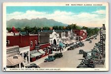 Main Street Alamosa Colorado CO Old Cars Bakery c1920 Postcard picture