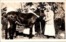 RPPC Woman Hugging Donkey Mule Man Holding Tail Up c1910s photo postcard FP6 picture