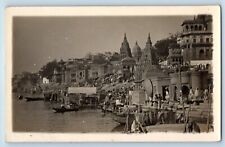 India RPPC Photo Postcard Boat Sailing Crowd Scene Near Varanasi Temple c1940's picture