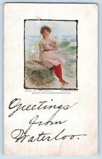 Waterloo Iowa IA Postcard Greetings Embossed Woman Sitting At The Beach 1920 picture