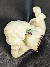 Vintage Cherub Laying Down With Gold Tipped Wings Figurine picture