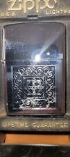 2000 XVI Zippo With etching of cross center inside of spiral designs picture