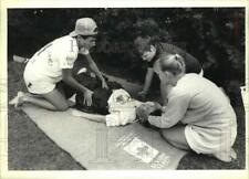 1989 Press Photo Lifeguards Perform First Aid in Green Lakes Park Competition picture