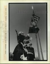 1989 Press Photo Flags raised and saluted during Veteran's Day ceremony picture