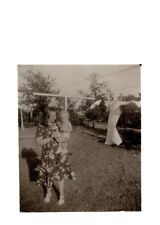 Vintage 1920s Photograph Named, girl holding child in yard picture