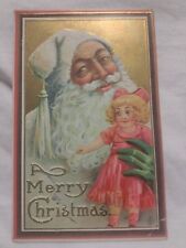 Christmas Postcard White Suited Santa Claus with Green Glove Holding Pink Doll picture