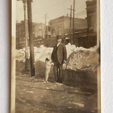 Antique Sepia Snapshot Photograph Man On Street With Dog Doing Trick Snow Odd picture