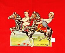 Early 1930's Mechanical Valentine Postcard, Boy & Girl Riding Zebra picture