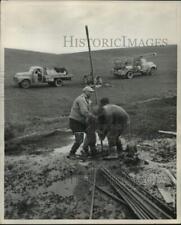 1955 Press Photo Engineers sink explosives in the Dunes, hoping to get oil picture