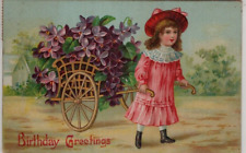 1909 ANTIQUE EMBOSSED BIRTHDAY Postcard    YOUNG GIRL IN PINK, PULLING GOLD CART picture