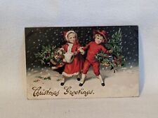 Postcard Christmas Greetings Boy and Girl in Red with Baskets Embossed 1912 A20 picture