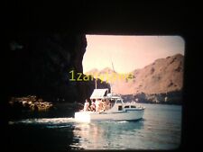 3U05 VINTAGE Photo 35mm Slide PEOPLE ON SMALL PASSENGER BOAT ROCKY SHORE IN BAY picture