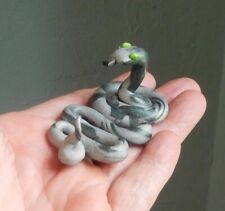 Handcrafted Clay Snake Figurine picture