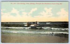 1910's OCEAN CITY MD LIFE SAVING CREW BOAT COMING THROUGH THE BREAKERS POSTCARD picture