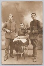 WWI German RPPC 3 Young Male Soldiers Postcard picture
