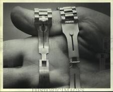 1984 Press Photo Closeup of clasps on real and counterfeit Rolex watches picture