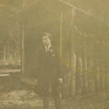 Vintage RPPC Postcard Young Man in Suit at Log Cabin c.early 1900's Real Photo picture