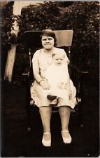 c1920s RPPC Photo Postcard Little Girl with Baby in Lap / Chair in House Yard picture