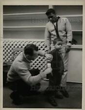 1963 Press Photo Tailor fits Floyd Patterson's son with suit in New York shop picture