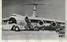 1968 Press Photo Fire truck parked in front of C-5A Galaxy with blown tire, GA picture