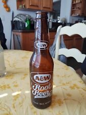 Brown A&W White Embossed Root Beer Bottle. picture