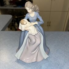 Detailed Porcelain Mother Holding Baby 10