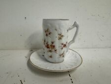 Antique Porcelain Demitasse and Saucer with Multicolored Floral Decorations picture