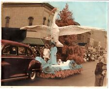 Great 1940's tinted image,parade, float,huge stork,baby in sling,Baby Boomers picture