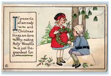 c1910's Christmas Holly Wreaths Two Girls Pine Tree Covered Snow Winter Postcard picture