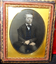 1/9th size Daguerreotype of young man in half case picture