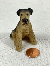 Miniature resin beige & black dog with a black nose. 2 1/2