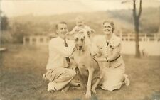 c1930 RPPC Portrait Young Couple on Lawn w Baby Sitting on their Great Dane Dog picture