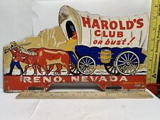 EARLY PAINTED METAL USED RENO NEVADA HAROLD'S CLUB OR BUST LICENSE PLATE TOPPER picture