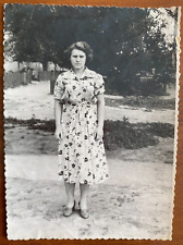 Beautiful girl in the yard. Vintage photo picture