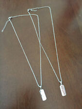 A Pair Of Silver Chain Necklaces With BFF Pendants 18
