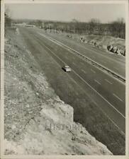 1957 Press Photo Rock cut along on Massachusetts Turnpike in Framingham picture