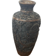 An antique vase decorated with old drawings made of bone and resin picture