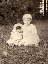 RPPC Cute Little Girl w Antique Doll in Grass Vintage Real Photo Postcard c 1905 picture