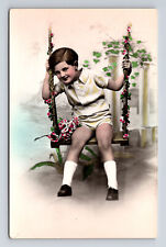 RPPC Alfred Noyer French Boy in Swing Flowers Hand Colored Real Photo Postcard picture