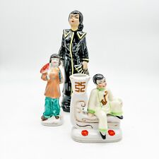 Occupied Japan Figurines/Woman Holding Fan (2)/Man Sitting on Ledge Candleholder picture