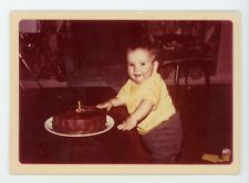 Chubby  toddler with one year birthday cake Vintage color snapshot photo picture