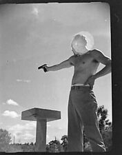 VINTAGE BW PHOTO NEGATIVE - Shirtless Man Pointing a Gun - Sun Shining picture