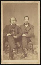 Photo:Two unidentified men, seated, facing front picture
