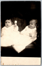 1920s RPPC Real Photo Postcard Pair Of Babies One Baby Holding a Rattle picture