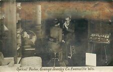 Postcard RPPC 1916 Wisconsin Evansville Optical Parlor Grange WI24-1007 picture