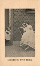 1909 Something Doing Here Child Looking Lovers Cuddling Romance Vintage Postcard picture