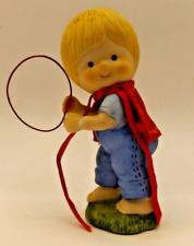 Enesco Country Cousins Scooter wearing red cape and holding red ring picture
