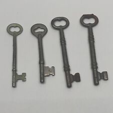 4 Vintage Solid Barrel Antique Skeleton Keys In A Variety Of Cuts And Sizes picture